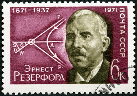USSR - CIRCA 1971: A stamp printed in USSR shows Ernest Rutherford (1871-1937) and Diagram of Movement of Atomic Particles, circa 1971のeditorial素材