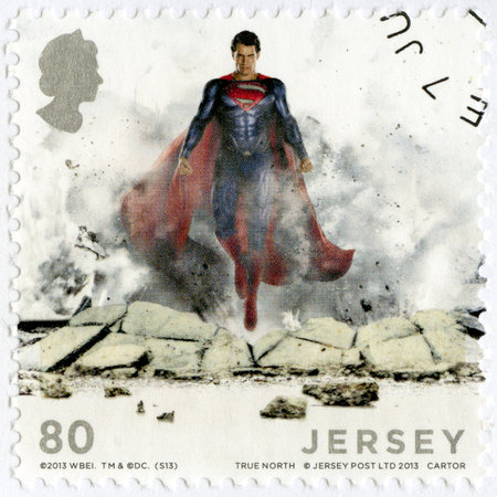 JERSEY - CIRCA 2013: A stamp printed in Jersey shows Man Of Steel, circa 2013のeditorial素材