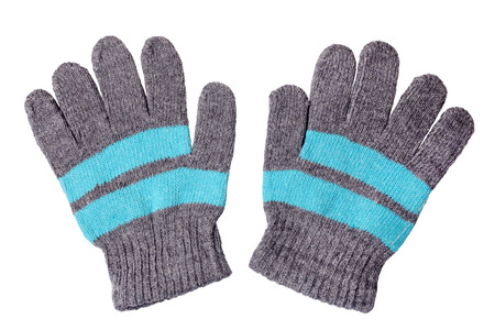 Warm woolen knitted gloves isolated on white backgroundの写真素材