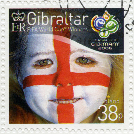 GIBRALTAR - CIRCA 2006 : A stamp printed in Gibraltar shows child with face painted as flag of England, devoted 2006 World Cup Soccer Championships, Germany, circa 2006のeditorial素材