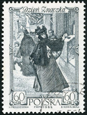 POLAND - CIRCA 1962: A stamp printed in Poland shows Woman Mailing Letter Warsaw, circa 1962のeditorial素材