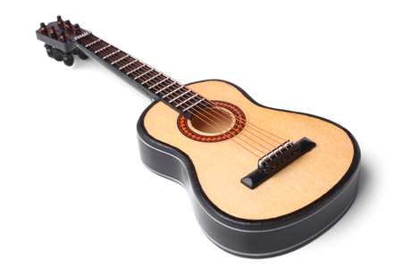 Miniature acoustic guitar on white backgroundの写真素材