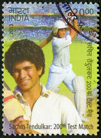 INDIA - CIRCA 2013  A stamp printed in India shows Sachin Tendulkar, cricketer player, dedicated 200th Test Match, circa 2013のeditorial素材