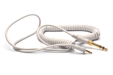 3,5mm Stereo Male to 6,3mm Strereo TRS Male Audio Cable on white backgroundの写真素材