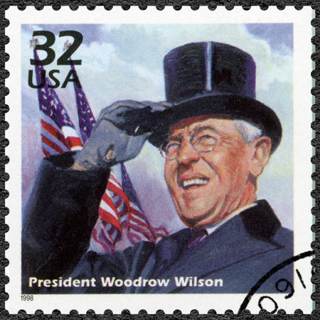 UNITED STATES OF AMERICA - CIRCA 1998: A stamp printed in USA shows Woodrow Wilson, series Celebrate the Century, 1910s, circa 1998のeditorial素材