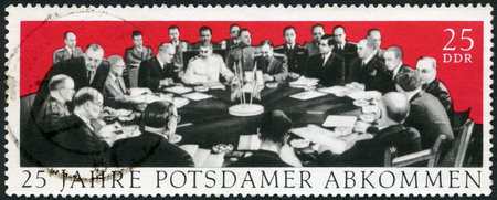 GERMANY - CIRCA 1970: A stamp printed in Germany dedicate 25th anniversary of the Potsdam Agreement among the Allies concerning Germany at the end of WWII, Potsdam Conference in 1945 with Winston Churchill, Harry S. Truman and Joseph Stalin, circa 1970のeditorial素材