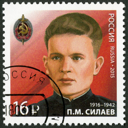 RUSSIA - CIRCA 2015: A stamp printed in Russia shows Pavel Mikhaylovich Silayev (1916-1942), devoted End World War II 70th anniversary, series of security divisions outstanding officers NKVD, circa 2015のeditorial素材