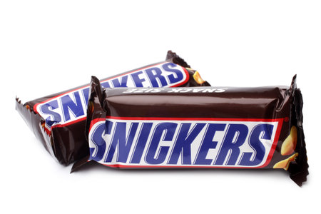 ST. PETERSBURG, RUSSIA - September 18, 2014: Photo of a Snickers candy chocolate bars on white background. Made by Mars, Incorporatedのeditorial素材