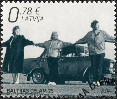LATVIA - CIRCA 2014: A stamp printed in Latvia shows Baltic Chain, devoted The 25th Anniversary of Independence - Joint Issue with Estonia and Lithuania, circa 2014のeditorial素材