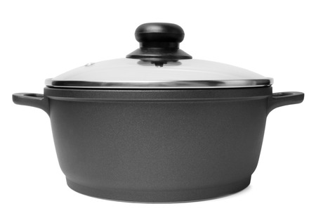 Stainless pan with glass lid on white backgroundの写真素材