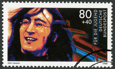 GERMANY - CIRCA 1988: A stamp printed in Germany shows John Winston Ono Lennon (1940-1980), series Rock Stars, circa 1988のeditorial素材