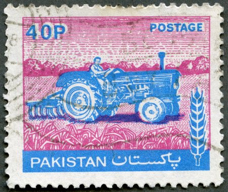 PAKISTAN - CIRCA 1978: A stamp printed in Pakistan shows Tractor, circa 1978のeditorial素材