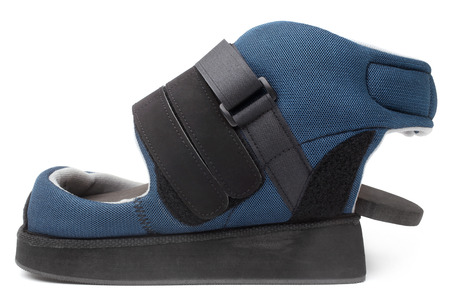 Post operative heel off-loading shoe on white background