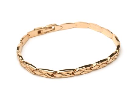 Gold bracelet on white backgroundの写真素材