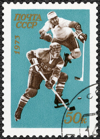USSR - CIRCA 1973: A stamp printed in USSR shows hockey player, World and European Ice Hockey Championships, Moscow, circa 1973のeditorial素材
