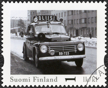 FINLAND - CIRCA 2013: A stamp printed in Finland shows Volvo PV 444, series Finland Official Vintage Police Car, circa 2013のeditorial素材