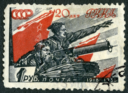 USSR - CIRCA 1938: A stamp printed in USSR shows Chapaev and Boy, Vasily Ivanovich Chapayev (1887-1919), The Workers and Peasants Red Army 20 anniversary 1918-1938, circa 1938のeditorial素材