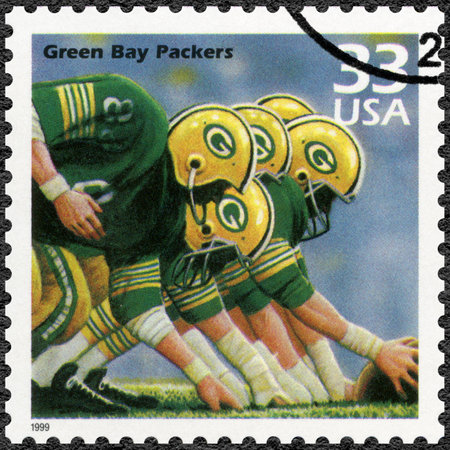 UNITED STATES OF AMERICA - CIRCA 1999: A stamp printed in USA shows Green Bay Packers, series Celebrate the Century, 1960s, circa 1999のeditorial素材
