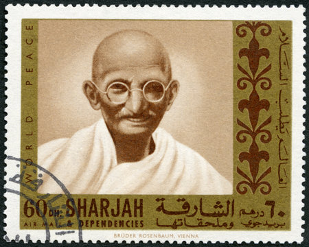 UAE - CIRCA 1970: A stamp printed in Sharjah United Arab Emirates UAE shows portrait of Mohandas Karamchand Gandhi (1869-1948), series Martyrs of Freedom, circa 1968のeditorial素材