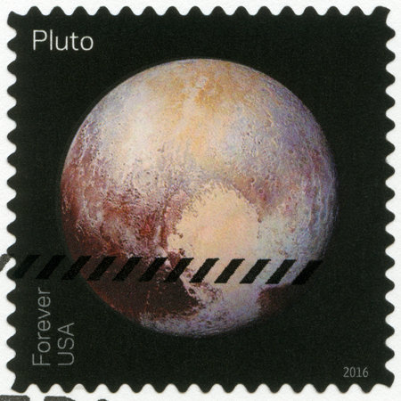 UNITED STATES OF AMERICA - CIRCA 2016: A stamp printed in USA shows The Pluto, series Pluto-Explored, circa 2016のeditorial素材