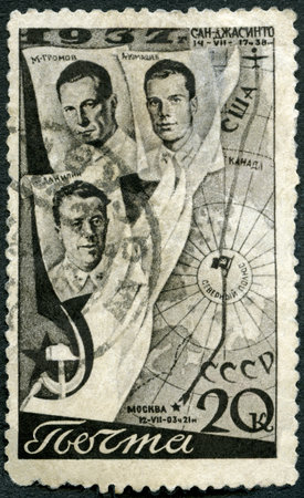 USSR - CIRCA 1938: A stamp printed in USSR shows Aviators Gromov, Danilin, Yumashev and Flight Route, First Trans-Polar flight, June 18-20, 1937, from Moscow to San Jacinto, circa 1938のeditorial素材
