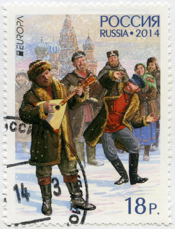 RUSSIA - CIRCA 2014: A stamp printed in Russia shows men with balalaika and bayan, Russian National Musical Instruments, Europa issue, circa 2014のeditorial素材