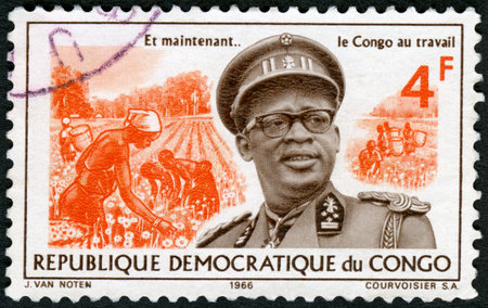 CONGO - CIRCA 1966: A stamp printed in Republic of the Congo shows Joseph Desire Mobutu (1930-1996), Sese Seko Kuku Ngbendu Wa Za Banga, Pyrethrum harvest, president Congo, circa 1966のeditorial素材