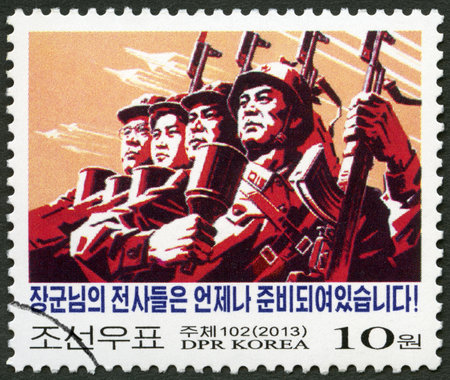 NORTH KOREA - CIRCA 2013: A stamp printed in North Korea shows Soldiers, Against Imperialism, circa 2013のeditorial素材
