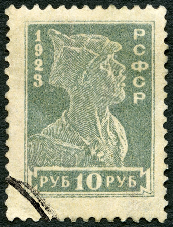 USSR - CIRCA 1923: A stamp printed in USSR shows Soldier, circa 1923のeditorial素材