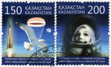 KAZAKHSTAN - CIRCA 2013: A stamp printed in Kazakhstan devoted 50th anniversary of spaceflight of the first spacewoman from Baikonur spaceport, circa 2013のeditorial素材
