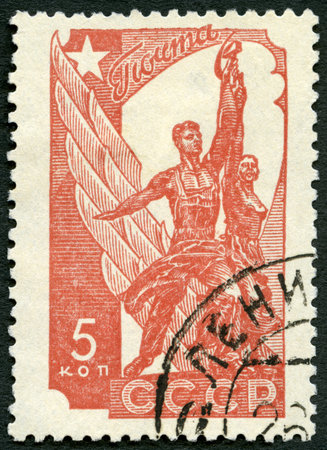 USSR - CIRCA 1938: A stamp printed in USSR shows Worker and Peasant monument, circa 1938のeditorial素材