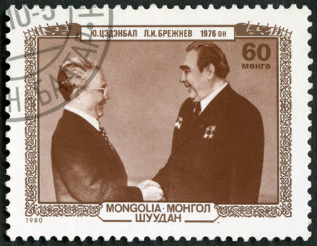 MONGOLIA - CIRCA 1980: A stamp printed in Mongolia shows Leonid Ilyich Brezhnev (1906-1982) and Yumjaagiin Tsedenbal (1916-1991), circa 1980のeditorial素材