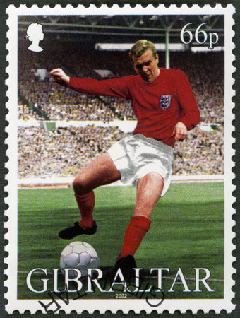 GIBRALTAR - CIRCA 2002: A stamp printed in Gibraltar shows Robert Frederick Chelsea Bobby Moore (1941-1993), 1966 World Cup Soccer Champions, series commemorates England Captain Bobby Moore, circa 2002のeditorial素材