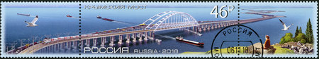 RUSSIA - CIRCA 2018: A stamp printed in Russia shows The Crimean Bridge, Architectural Structures, circa 2018のeditorial素材