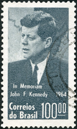 BRAZIL - CIRCA 1964: A stamp printed in Brazil shows John F. Kennedy (1917-1963), in memoriam, circa 1964のeditorial素材