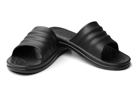 Black rubber slippers on white backgroundの販売画像