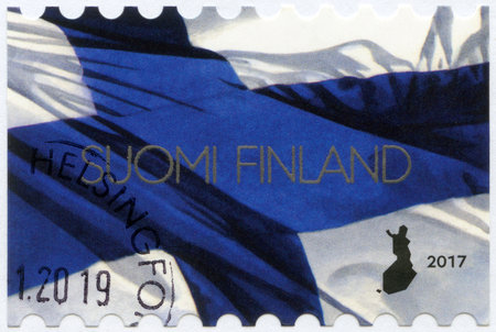 FINLAND - CIRCA 2017: A stamp printed in Finland shows the Finnish national flag, the Blue Cross flag, circa 2017のeditorial素材