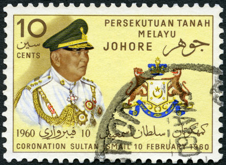 MALAYA - CIRCA 1960: A stamp printed by Malaya shows Sultan Ismail and Johore State Crest Seal,...