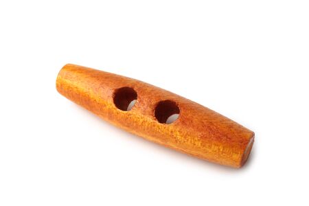 Wooden sewing button on white backgroundの写真素材