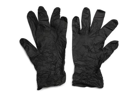 Black nitrile protective gloves on white backgroundの写真素材