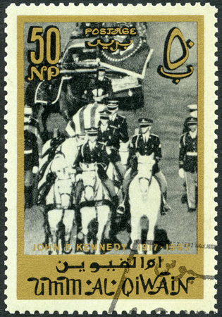 UMM AL-QUWAIN - CIRCA 1965: A stamp printed in Umm al-Quwain shows funeral train, memoreal state funeral John F. Kennedy (1917-1963), circa 1965のeditorial素材