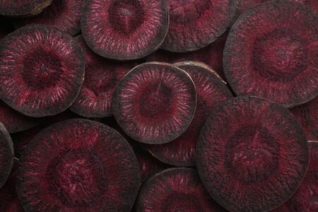Slices of purple carrot, for backgrounds or texturesの写真素材
