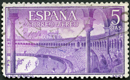 SPAIN - CIRCA 1960: A stamp printed in Spain shows Bull ring, Spanish style bullfighting, corrida, circa 1960のeditorial素材