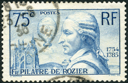 FRANCE - CIRCA 1936: A stamp printed in France shows portrait Pilatre de Rozier (1754-1785) and his Balloon, 150th anniversary of the death of Jean Francois Pilatre de Rozier, balloonist, circa 1936のeditorial素材