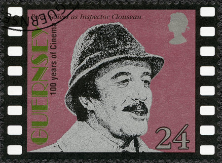 GUERNSEY - CIRCA 1996: A stamp printed in Guernsey shows Peter Sellers (1925-1980), actor, Motion Pictures Century, circa 1996のeditorial素材