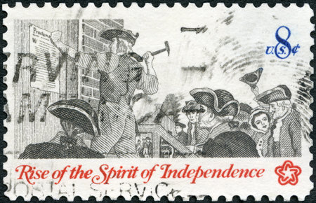 UNITED STATES OF AMERICA - CIRCA 1973: A stamp printed in USA shows Posting a Broadside, Communications in Colonial Times, Rise of the Spirit of Independence, circa 1973のeditorial素材