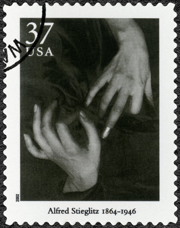 UNITED STATES OF AMERICA - CIRCA 2002: A stamp printed in USA shows Photo by Alfred Stieglitz (1864-1946), Hands and Thimble, series Masters of American Photography, circa 2002のeditorial素材
