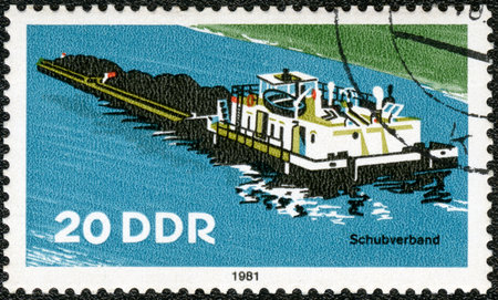 GERMANY - CIRCA 1981: A stamp printed in Germany shows Tugboat, River Boat, circa 1981のeditorial素材
