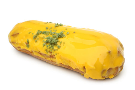 Eclair with mango cream on white
