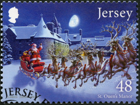 JERSEY - CIRCA 2016: A stamp printed in Jersey shows Father Christmas in Jersey, St Ouens Manor, circa 2016のeditorial素材
